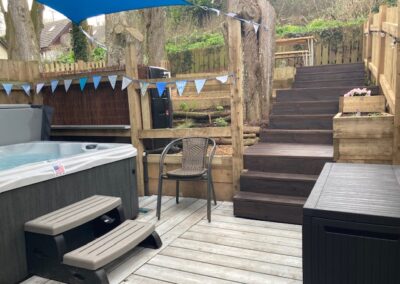 Hot tub and outside seating area in the woodland garden